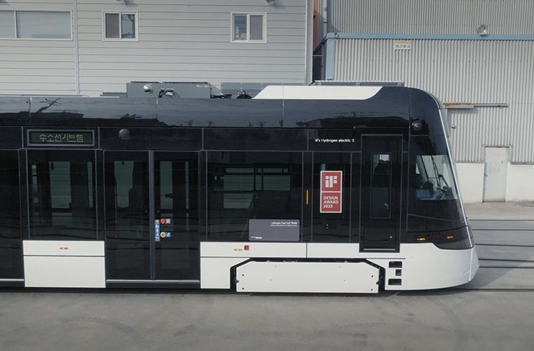 Hyundai’s hydrogen tram traveling through an urban environment.